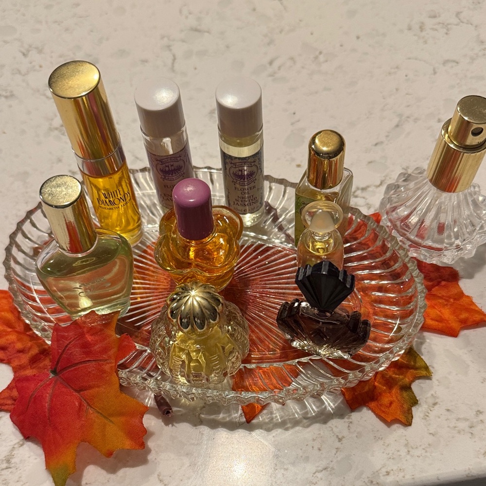 A collection of mini cologne, perfumes, and oils